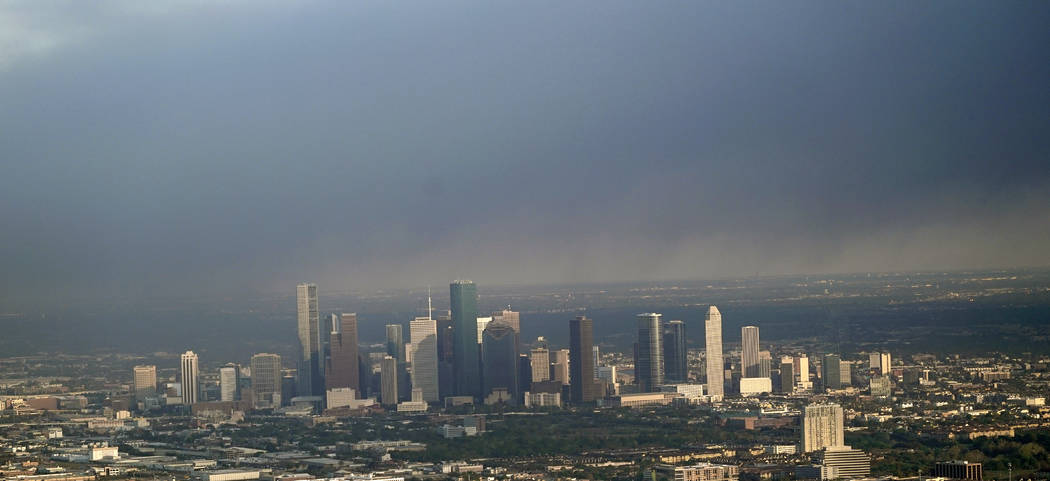 A plume of smoke from a petrochemical fire at the Intercontinental Terminals Company is shown over downtown Houston Monday, March 18, 2019. The large fire at the Houston-area petrochemicals termin ...