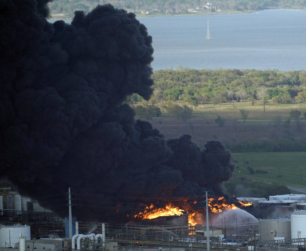 A plume of smoke rises from a petrochemical fire at the Intercontinental Terminals Company Monday, March 18, 2019, in Deer Park, Texas. The large fire at the Houston-area petrochemicals terminal w ...