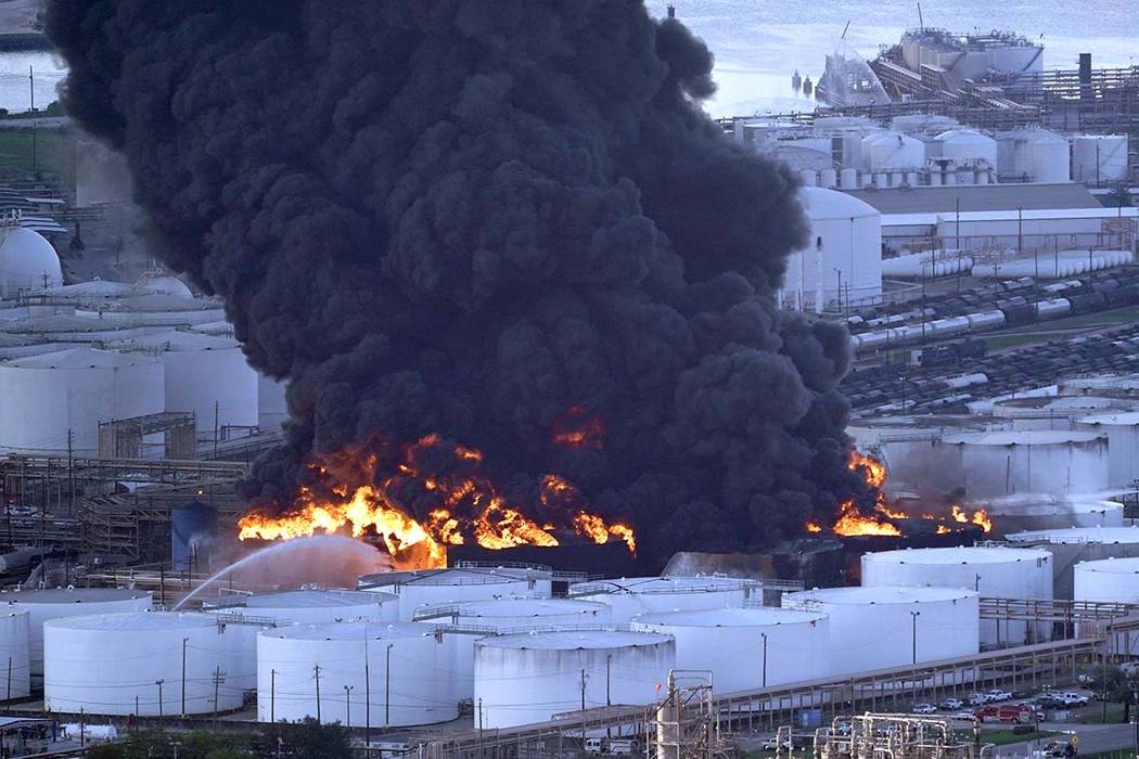 Firefighters battle a petrochemical fire at the Intercontinental Terminals Company Monday, March 18, 2019, in Deer Park, Texas. The large fire at a Houston-area petrochemicals terminal will likely ...