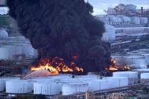 Firefighters battle a petrochemical fire at the Intercontinental Terminals Company Monday, March 18, 2019, in Deer Park, Texas. The large fire at a Houston-area petrochemicals terminal will likely ...