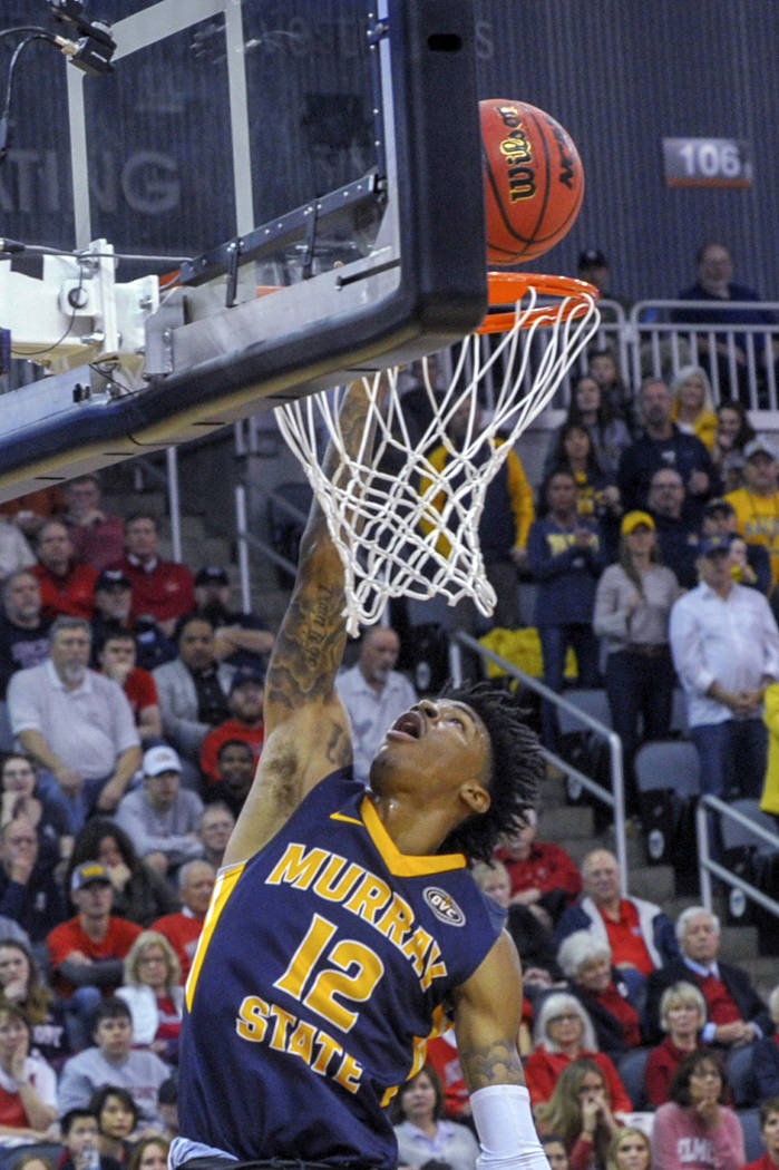 Murray State's Ja Morant (12) goes up for a slam dunk during the first half of an NCAA college basketball game in the championship of the Ohio Valley Conference basketball tournament, Saturday, Ma ...