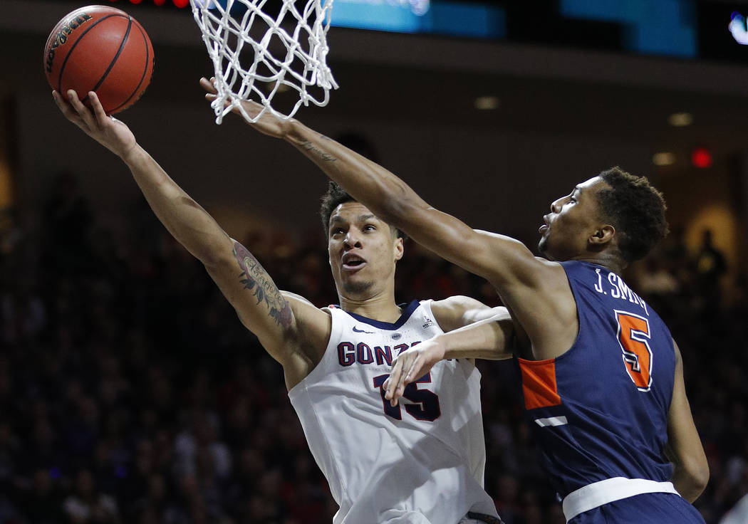 Gonzaga's Brandon Clarke shoots around Pepperdine's Jade' Smith during the first half of an NCAA semifinal college basketball game at the West Coast Conference tournament, Monday, March 11, 2019, ...