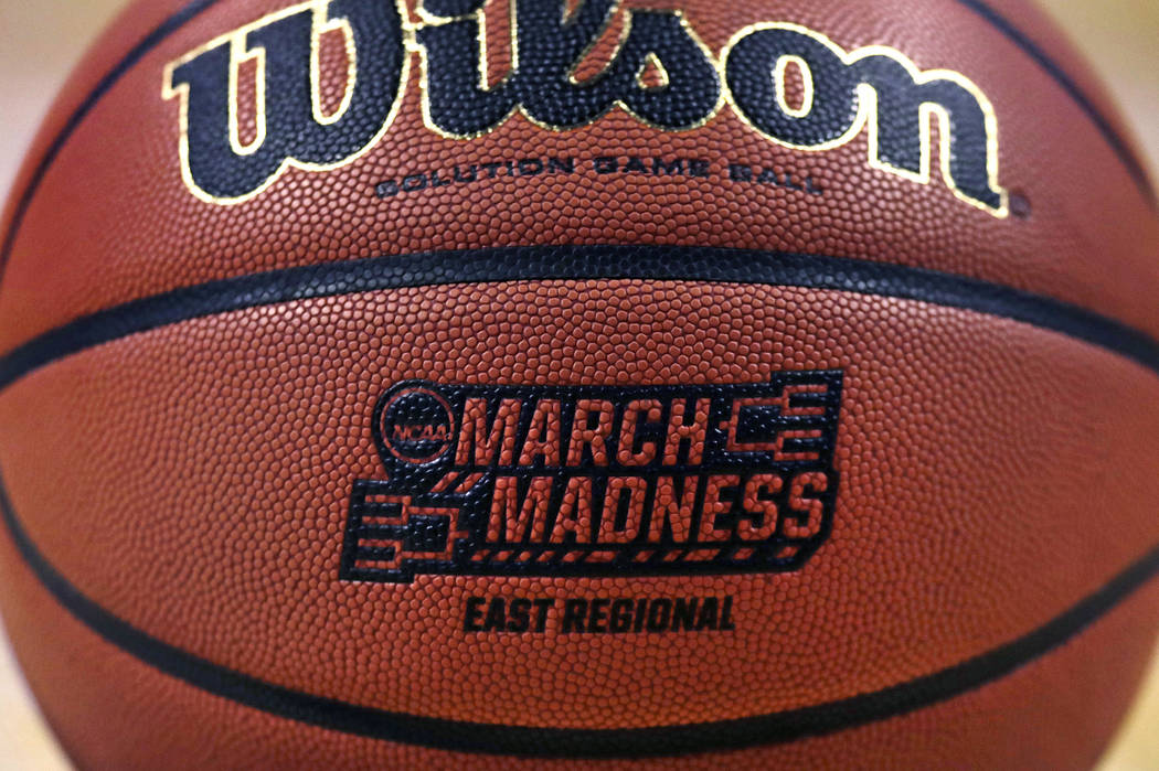 The "March Madness" logo adorns a ball resting on the court during practice at the NCAA men's college basketball tournament in Boston, Thursday, March 22, 2018. (AP Photo/Charles Krupa)