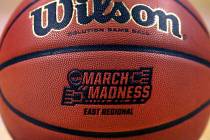 The "March Madness" logo adorns a ball resting on the court during practice at the NCAA men's college basketball tournament in Boston, Thursday, March 22, 2018. (AP Photo/Charles Krupa)