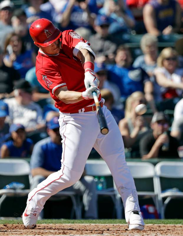 Los Angeles Angels' Mike Trout connects on a three-run home run against the Chicago Cubs in the third inning of a spring training baseball game Tuesday, March 5, 2019, in Tempe, Ariz. (AP Photo/El ...