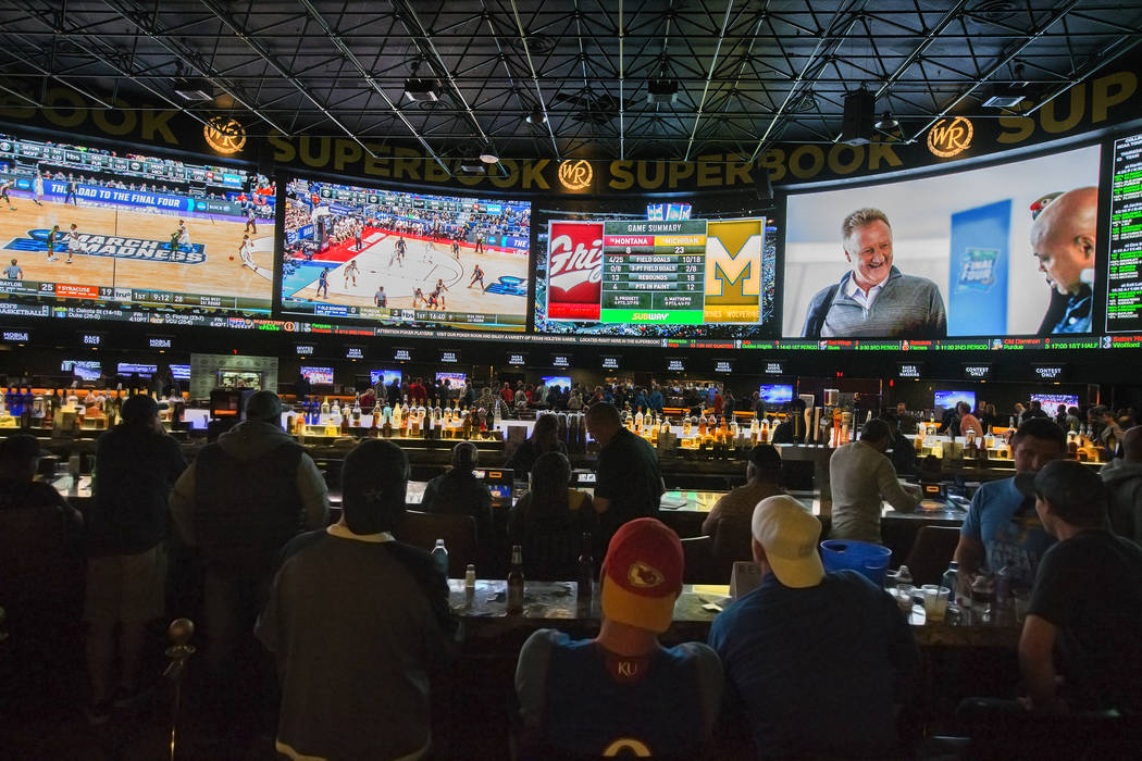 Basketball fans take in the first day of the NCAA Tournament at the Westgate Sportsbook on Thursday, March 21, 2019, at Westgate, in Las Vegas. (Benjamin Hager Review-Journal) @BenjaminHphoto
