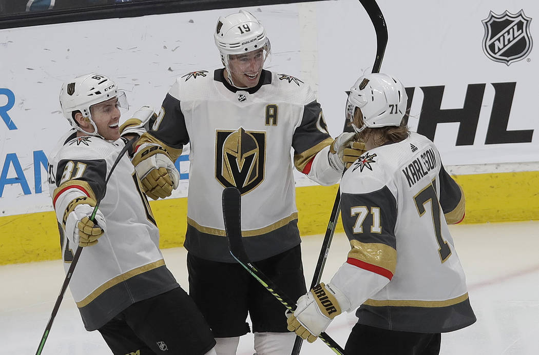 Vegas Golden Knights right wing Reilly Smith, center, celebrates with Jonathan Marchessault, left, and William Karlsson after scoring a goal against the San Jose Sharks during the third period of ...