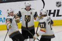 Vegas Golden Knights right wing Reilly Smith, center, celebrates with Jonathan Marchessault, left, and William Karlsson after scoring a goal against the San Jose Sharks during the third period of ...
