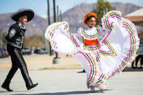 Shadaie Martinez, 17, of the Mexico Vivo dance company, right, performs with Gilberto Rodriguez, 14, during the Cesar Chavez Day festival at Freedom Park in Las Vegas on Saturday, March 23, 2019. ...