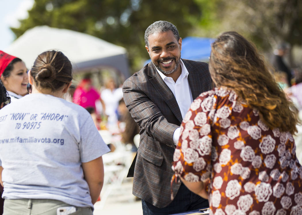 U.S. Rep. Steven Horsford, D-Nev., greets volunteers at the Mi Familia Vota booth during the Cesar Chavez Day festival at Freedom Park in Las Vegas on Saturday, March 23, 2019. (Chase Stevens/Las ...