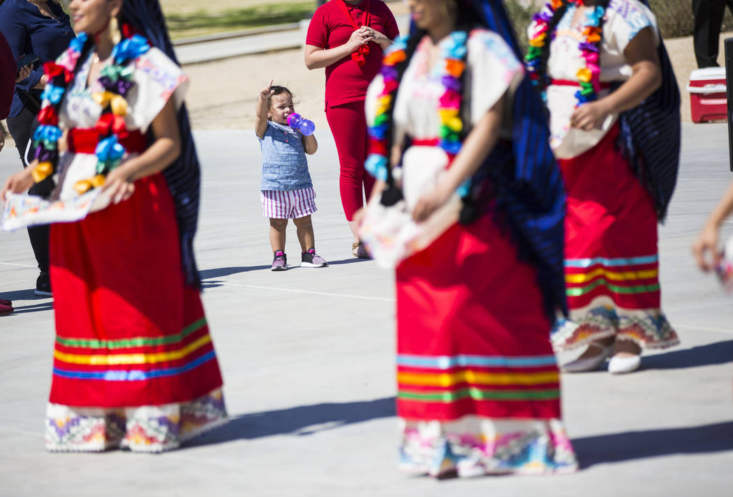 Two-year-old Sophia Medina dances along as to the Mexico Vivo dance company during the Cesar Chavez Day festival at Freedom Park in Las Vegas on Saturday, March 23, 2019. (Chase Stevens/Las Vegas ...