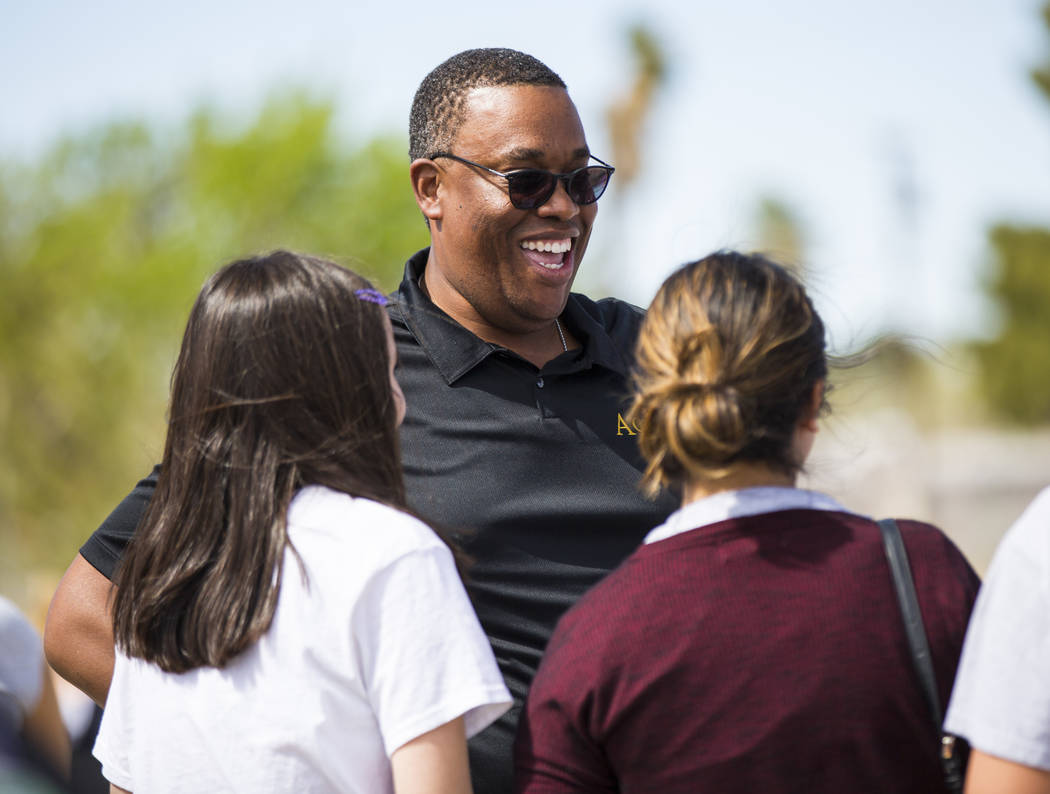 Las Vegas City Councilman Cedric Crear talks with volunteers at the Mi Familia Vota booth during the Cesar Chavez Day festival at Freedom Park in Las Vegas on Saturday, March 23, 2019. (Chase Stev ...