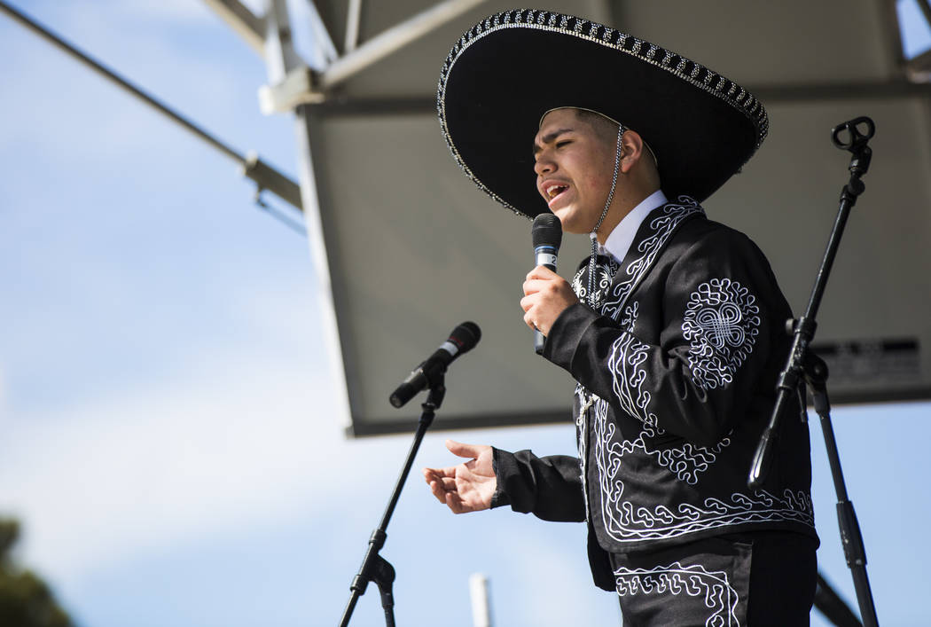 Gilberto Rodriguez, 14, of Las Vegas, sings during the Cesar Chavez Day festival at Freedom Park in Las Vegas on Saturday, March 23, 2019. (Chase Stevens/Las Vegas Review-Journal) @csstevensphoto