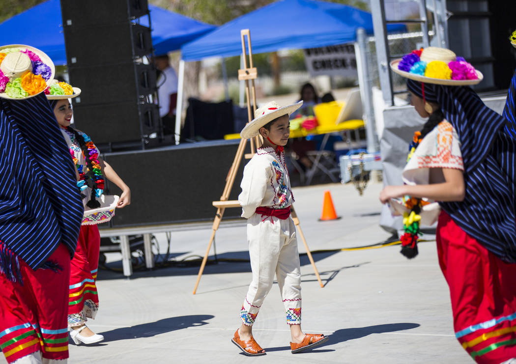 Marcus Tapia, 9, of the Mexico Vivo dance company, performs as part of a folklorico dance during the Cesar Chavez Day festival at Freedom Park in Las Vegas on Saturday, March 23, 2019. (Chase Stev ...