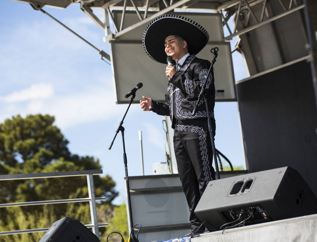 Gilberto Rodriguez, 14, of Las Vegas, sings during the Cesar Chavez Day festival at Freedom Park in Las Vegas on Saturday, March 23, 2019. (Chase Stevens/Las Vegas Review-Journal) @csstevensphoto