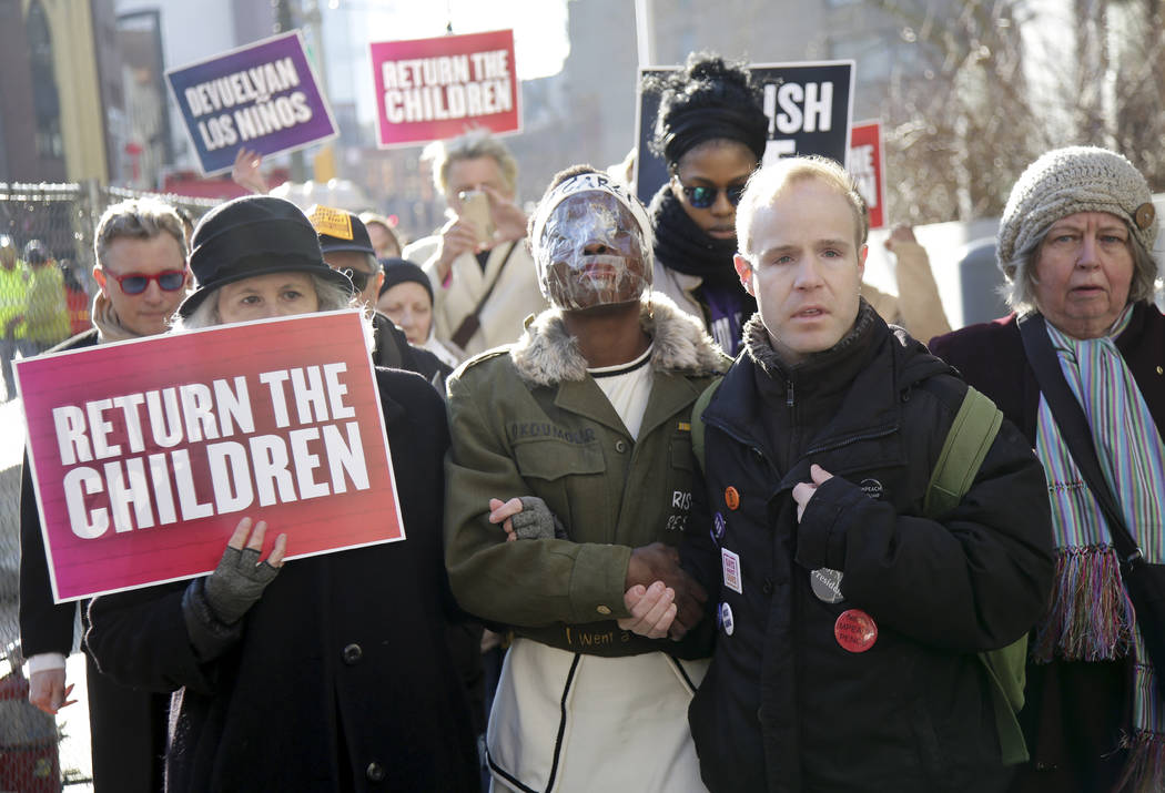 Therese Okoumou, center, walks with supporters to her sentencing in New York, Tuesday, March 19, 2019. Okoumou was convicted of trespassing and other offenses after she climbed the base of the Sta ...