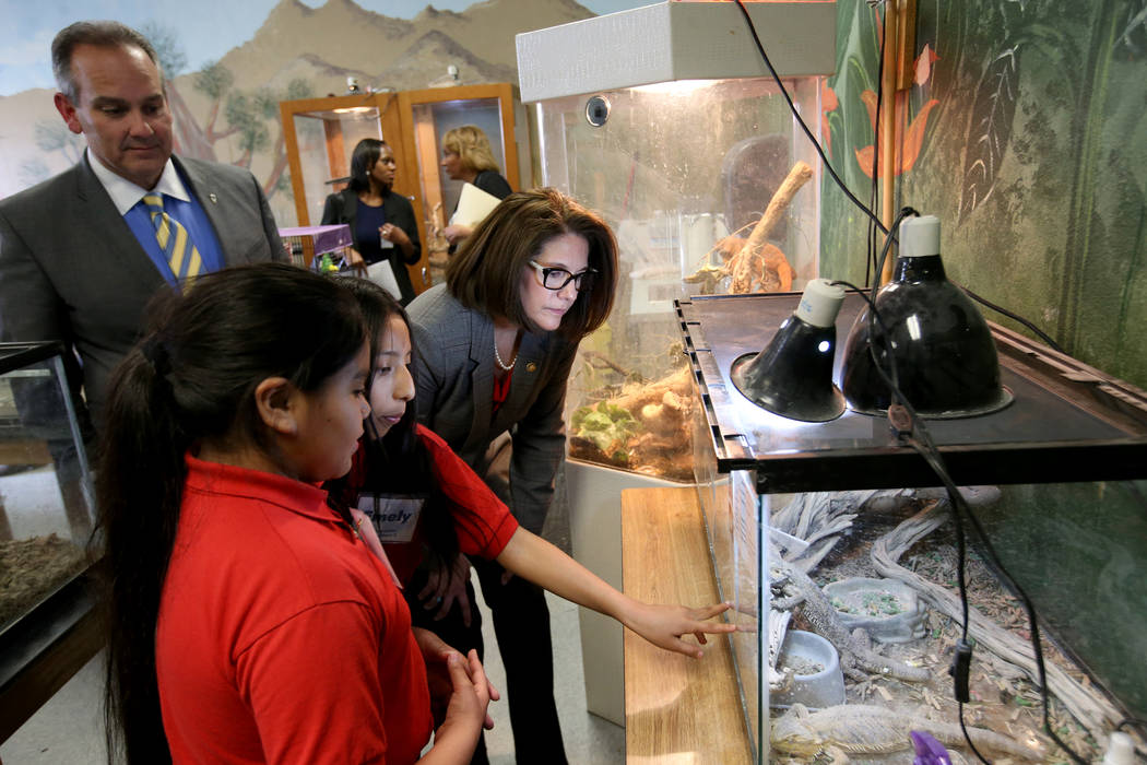 Hoggard Elementary fourth grade students Iris Hernandez, left, and Emely San Juan, both 10, give a tour to Clark County School District Superintendent Dr. Jesus F. Jara and Sen. Catherine Cortez M ...