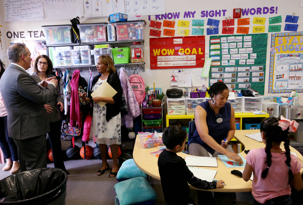 Hoggard Elementary principal Stacey Scott-Cherry, third from left, gives a tour to Clark County School District Superintendent Dr. Jesus F. Jara and Sen. Catherine Cortez Masto, D-Nev., as first g ...