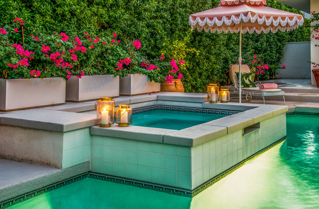 The pool area has a spa and lush landscaping. (Berkshire Hathaway HomeServices California Properties)