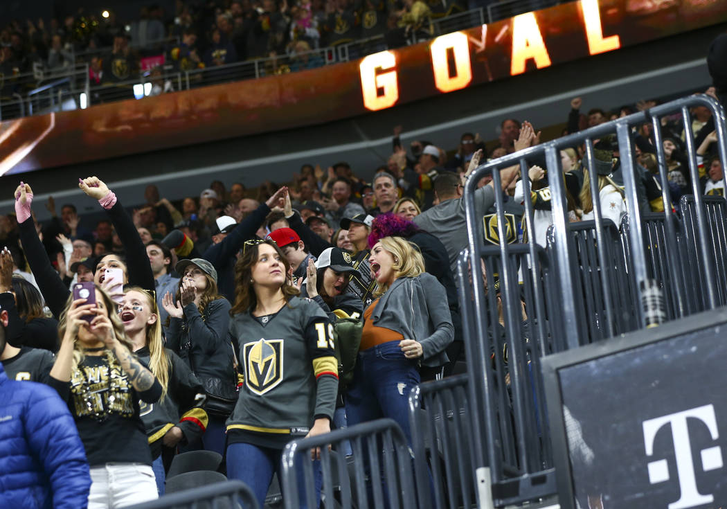 Golden Knights fans celebrate a goal by Golden Knights left wing Max Pacioretty, not pictured, during the second period of an NHL hockey game against the Dallas Stars at T-Mobile Arena in Las Vega ...