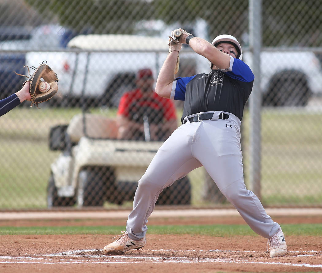 Basic's Trace Evans (24) leans back to avoid getting hit by the ball in the first inning of a baseball game at Liberty High School in Henderson, Tuesday, March 19, 2019. (Caroline Brehman/Las Vega ...