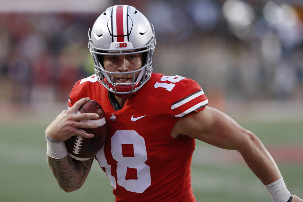 In this Sept. 22, 2018, file photo, Ohio State quarterback Tate Martell runs against Tulane during an NCAA college football game in Columbus, Ohio. (AP Photo/Jay LaPrete, File)