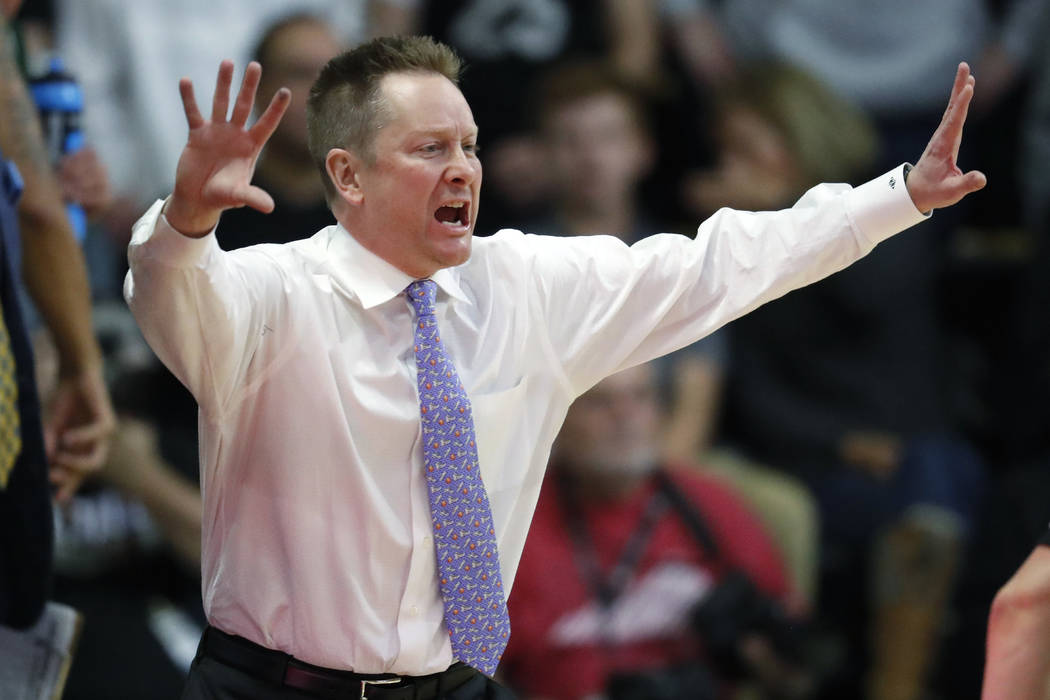 Colorado State head coach Niko Medved directs his team against Colorado in the first half of an NCAA college basketball game Saturday, Dec. 1, 2018, in Boulder, Colo. (AP Photo/David Zalubowski)