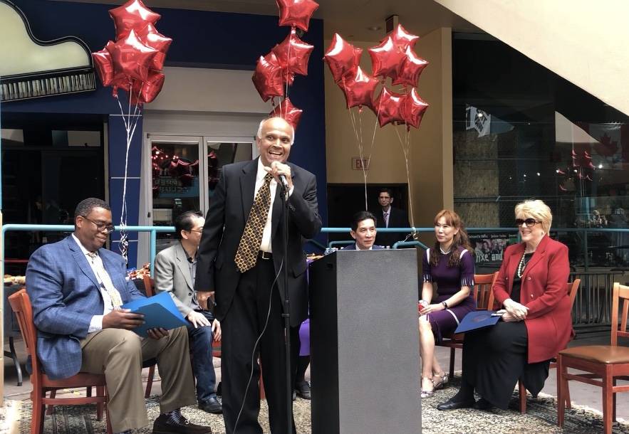 Neonopolis owner Rohit Joshi takes the mic as Las Vegas City Councilman Cedric Crear and Mayor Carolyn Goodman look on during the ribbon-cutting ceremony for Don't Tell Mama on Wednesday, March 20 ...