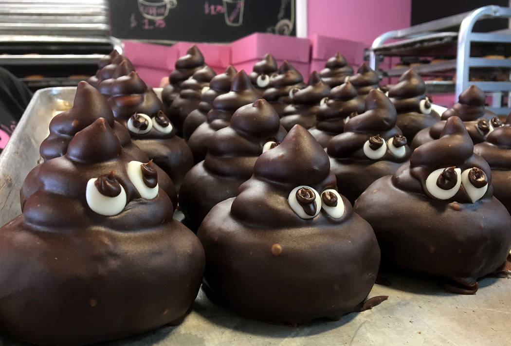 Poo emoji doughnuts are part of a lawsuit by Pinkbox Doughnuts who alleges a competitor is copying their trade secrets, designs and recipes. Wednesday, March 20, 2019. (Michael Quine/Las Vegas Rev ...
