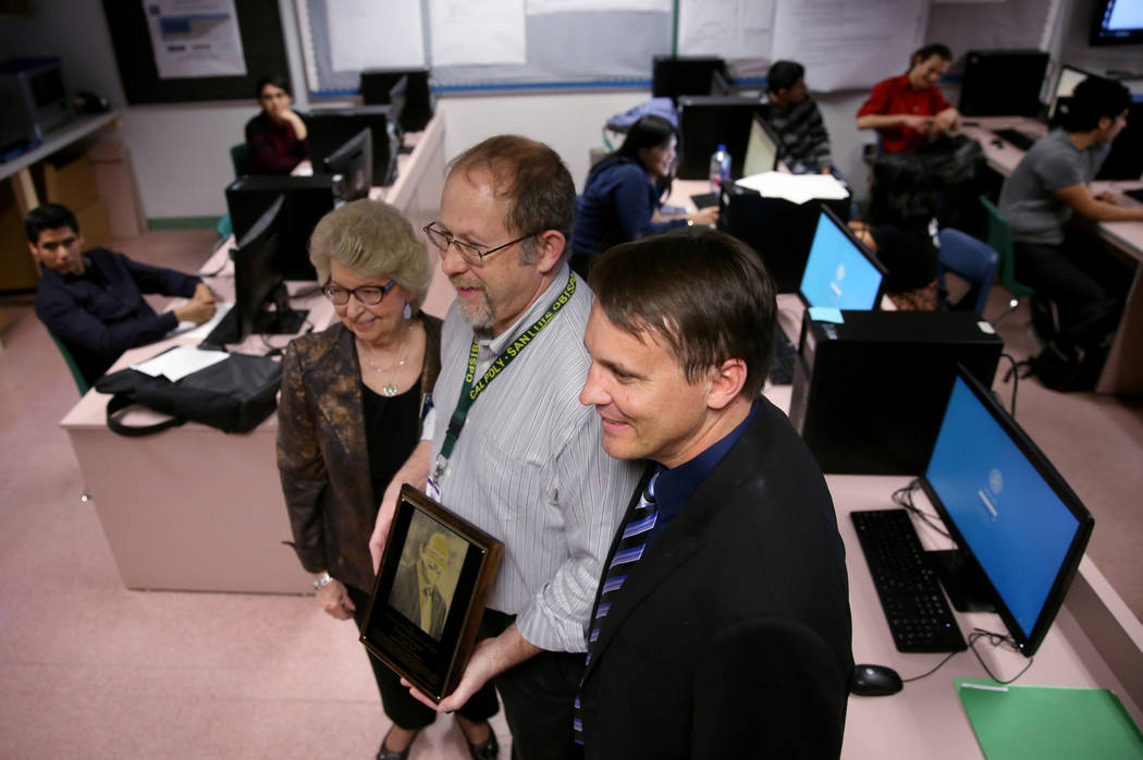 Advanced Technologies Academy teacher Richard Knoeppel, the Nevada Teacher of the Year, center, with Carol Strickland, executive director National Teacher Hall of Fame, and Principal Jonathan Syno ...
