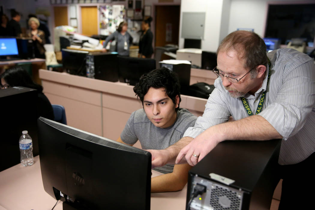 Advanced Technologies Academy teacher Richard Knoeppel, the Nevada Teacher of the Year, works with senior Edin Sosa at his Las Vegas school Wednesday, March 20, 2019. (K.M. Cannon/Las Vegas Review ...