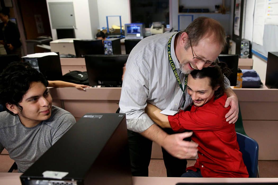 Advanced Technologies Academy teacher Richard Knoeppel, the Nevada Teacher of the Year, gets a hug from senior Isaac Carpenter after being told that he will be inducted into the National Teacher H ...