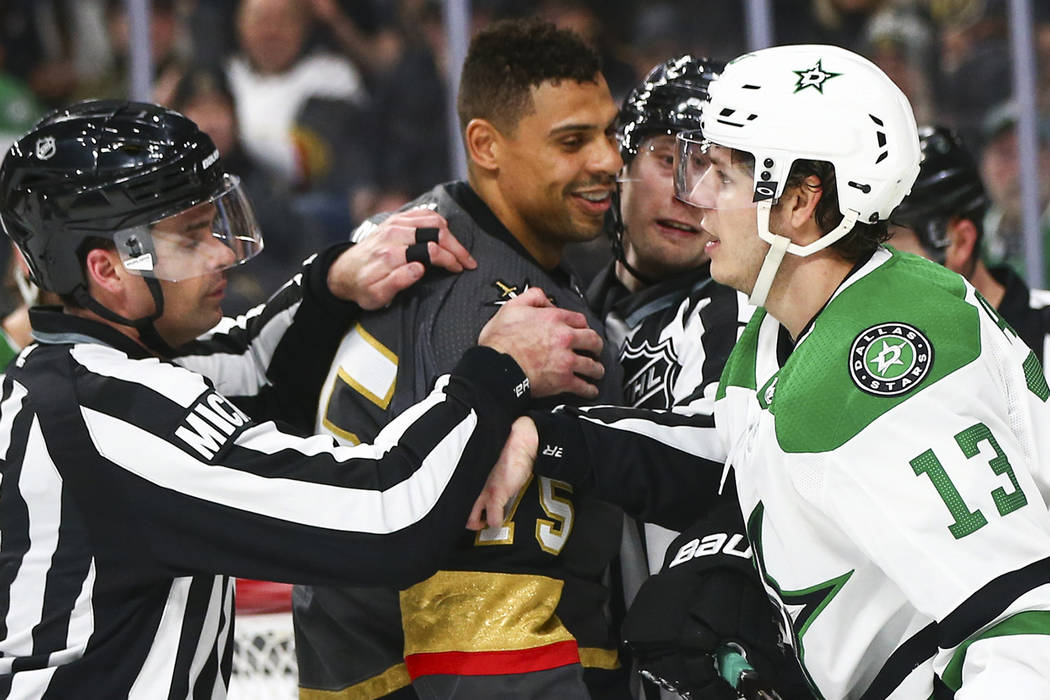 Golden Knights right wing Ryan Reaves (75) exchanges words with Dallas Stars center Mattias Janmark (13) during the second period of an NHL hockey game at T-Mobile Arena in Las Vegas on Tuesday, F ...