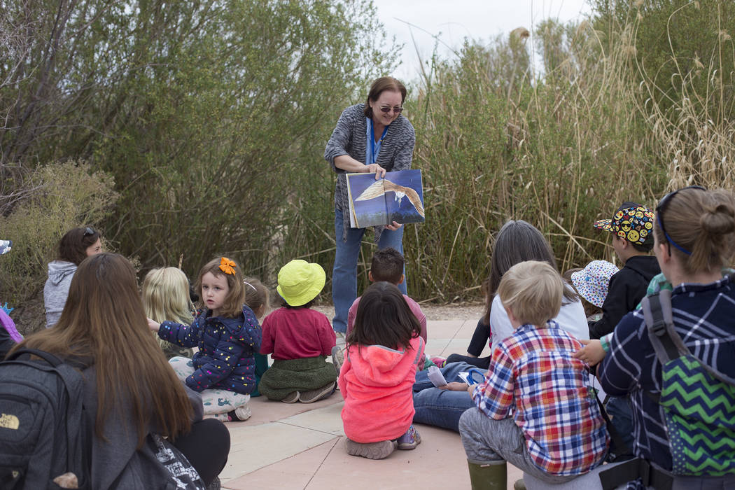 Volunteer Betty Monson reads a story to children during the Nature Tykes program at Clark County Wetlands Park in Las Vegas, Wednesday, March 20, 2019. The program incorporates story time, crafts, ...