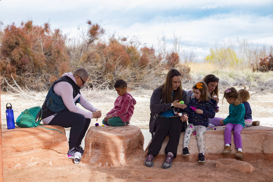 Parents help their children create a "bad mother" bird during the Nature Tykes program at Clark County Wetlands Park in Las Vegas, Wednesday, March 20, 2019. The program incorporates sto ...