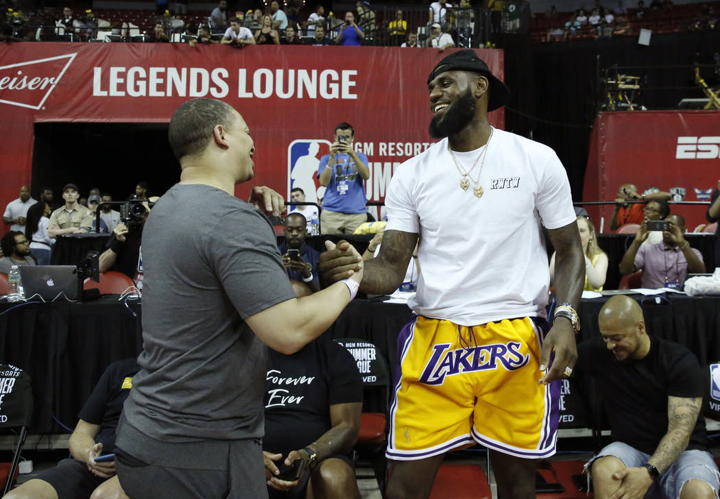 The Los Angeles Lakers LeBron James shakes hands with Cleveland Cavaliers coach Tyronn Lue at the Thomas and Mack Center during an NBA Summer League basketball game on Sunday, July 15, 2018, in L ...