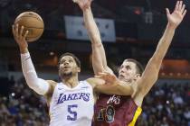 Los Angeles Lakers guard Josh Hart (5) drives past Cleveland Cavaliers forward Vladimir Brodziansky (19) in overtime during the NBA Summer League semifinals on Monday, July 16, 2018, at the Thomas ...