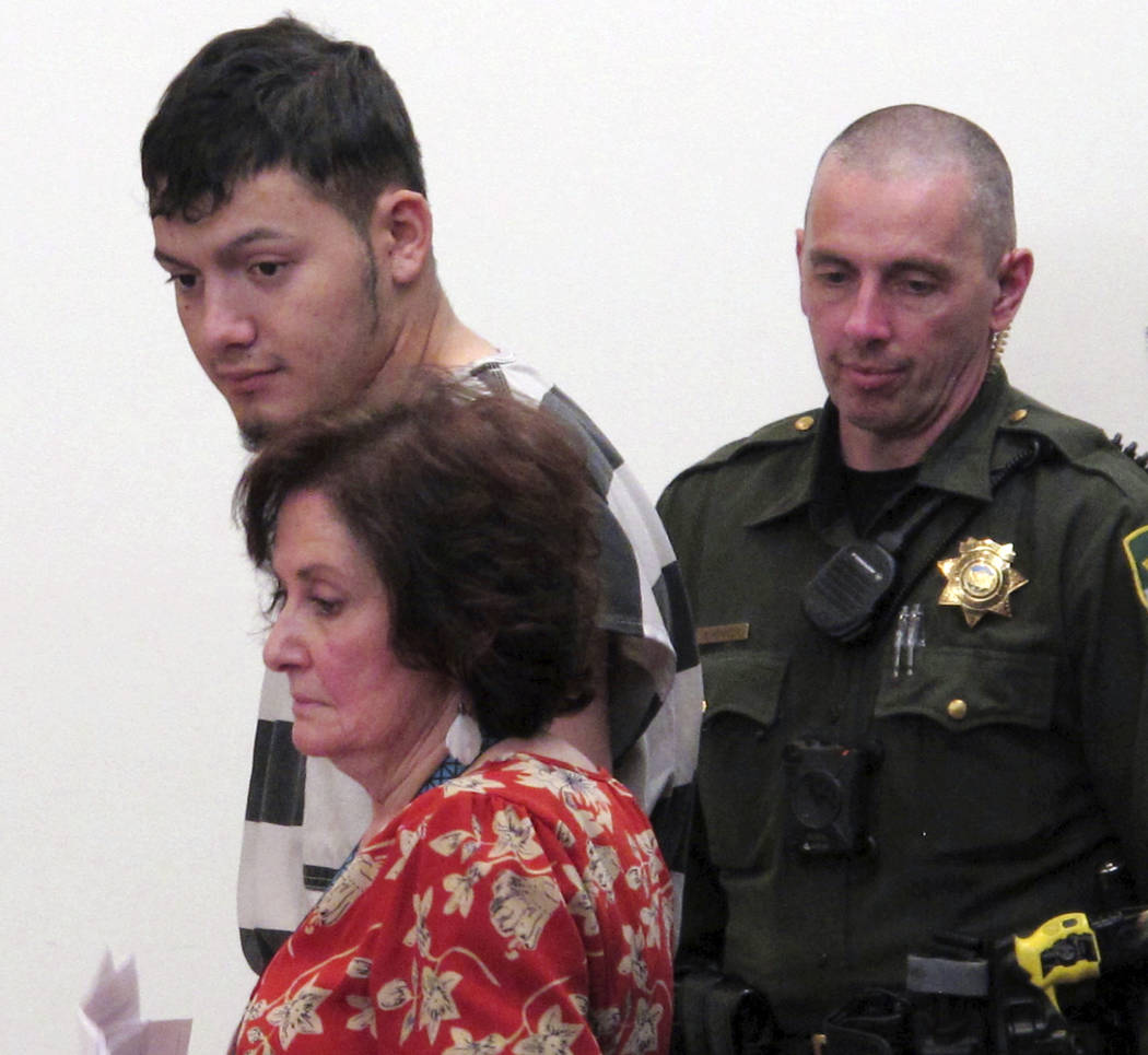 Wilber Ernesto Martinez-Guzman, 19, top left, of El Salvador, listens to proceedings during his initial appearance in Carson City Justice Court, Thursday, Jan. 24, 2019, in Carson City, Nev. Marti ...