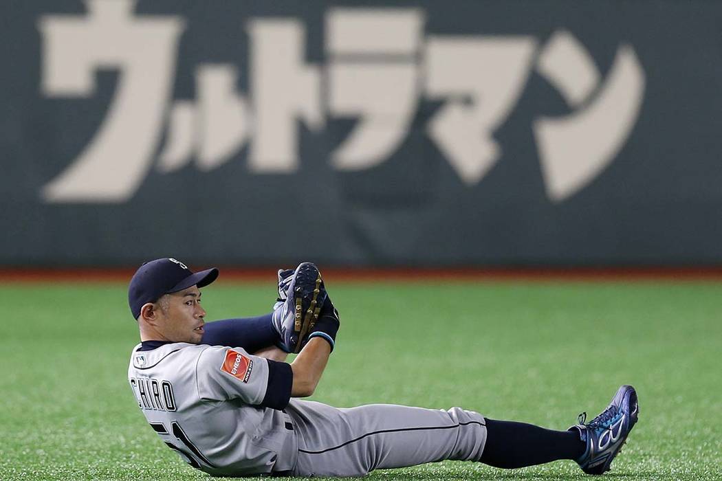Seattle Mariners right fielder Ichiro Suzuki stretches on the field prior to Game 2 of the Major League baseball opening series between the Mariners and the Oakland Athletics at Tokyo Dome in Toky ...