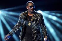 In this June 30, 2013 file photo, R. Kelly performs at the BET Awards in Los Angeles. Kelly has asked the Chicago judge to let him travel overseas for concerts in Dubai, saying he’s been unable ...