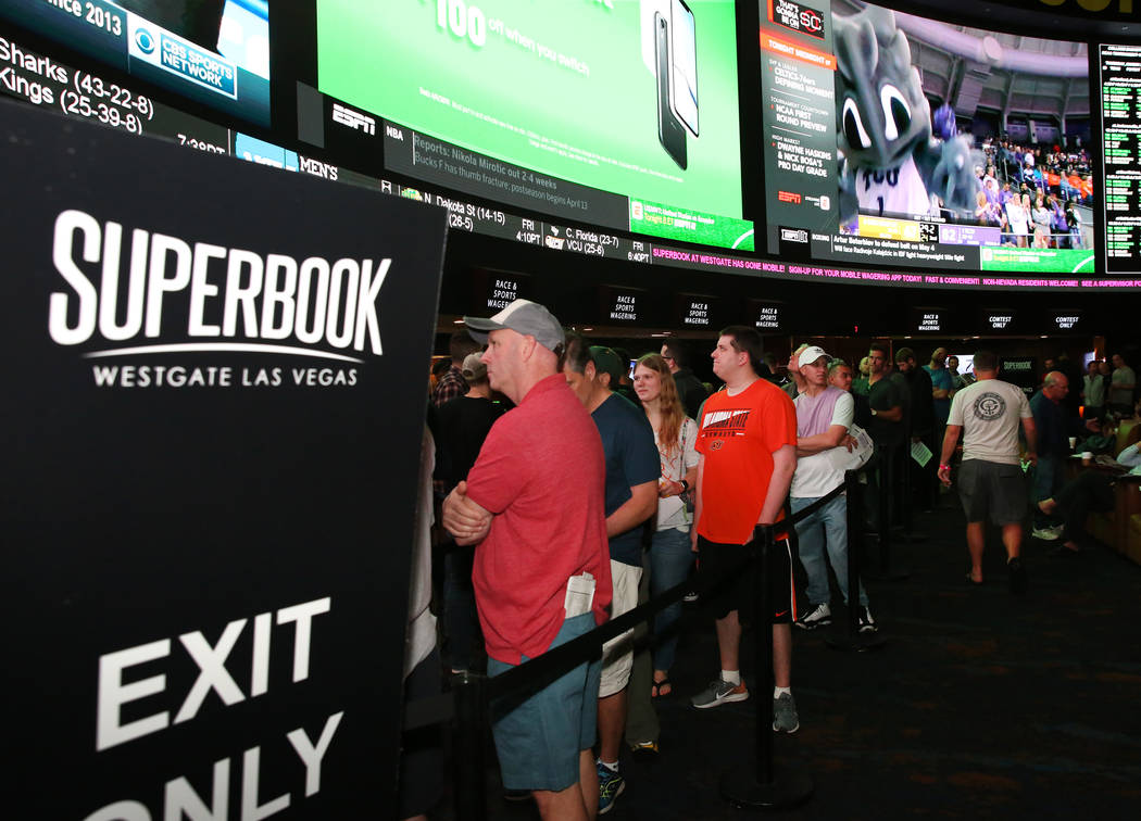 Fans lined up to place their bets during the first day of the NCAA basketball tournament at the Westgate sports book in Las Vegas on Thursday, March 16, 2019. (Bizuayehu Tesfaye Las Vegas Review-J ...