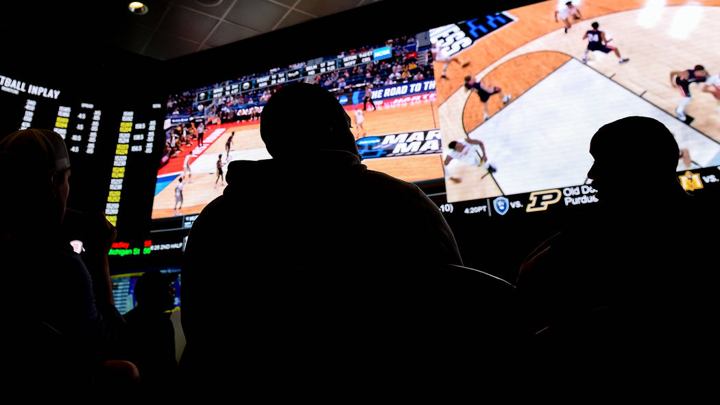 Fans watch the first round of the NCAA men's college basketball tournament at the newly opened sportsbook inside The Strat in Las Vegas, Thursday, March 21, 2019. (Caroline Brehman/Las Vegas Revie ...