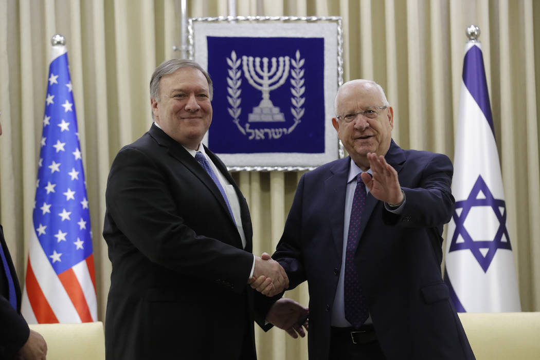 U.S. Secretary of State Mike Pompeo, left, and Israeli President Reuven Rivlin shake hands during their meeting in Jerusalem Thursday, March 21, 2019. (Jim Young/Pool Photo via AP)
