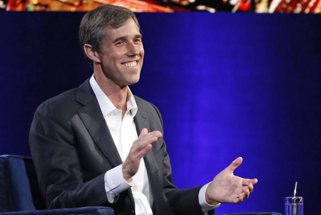 In this Feb. 5, 2019, photo, former Democratic Texas congressman Beto O'Rourke laughs as he is interviewed by Oprah Winfrey in New York. (AP Photo/Kathy Willens, File)