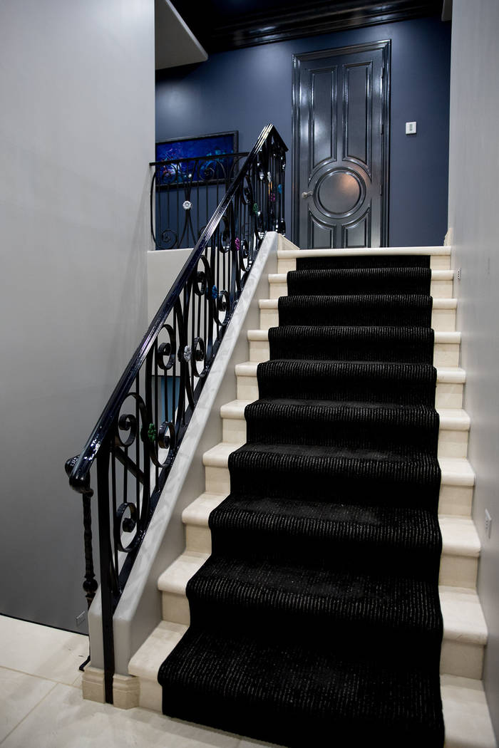 The staircase leads to two bedrooms and the game room upstairs. (Tonya Harvey Real Estate Millions)