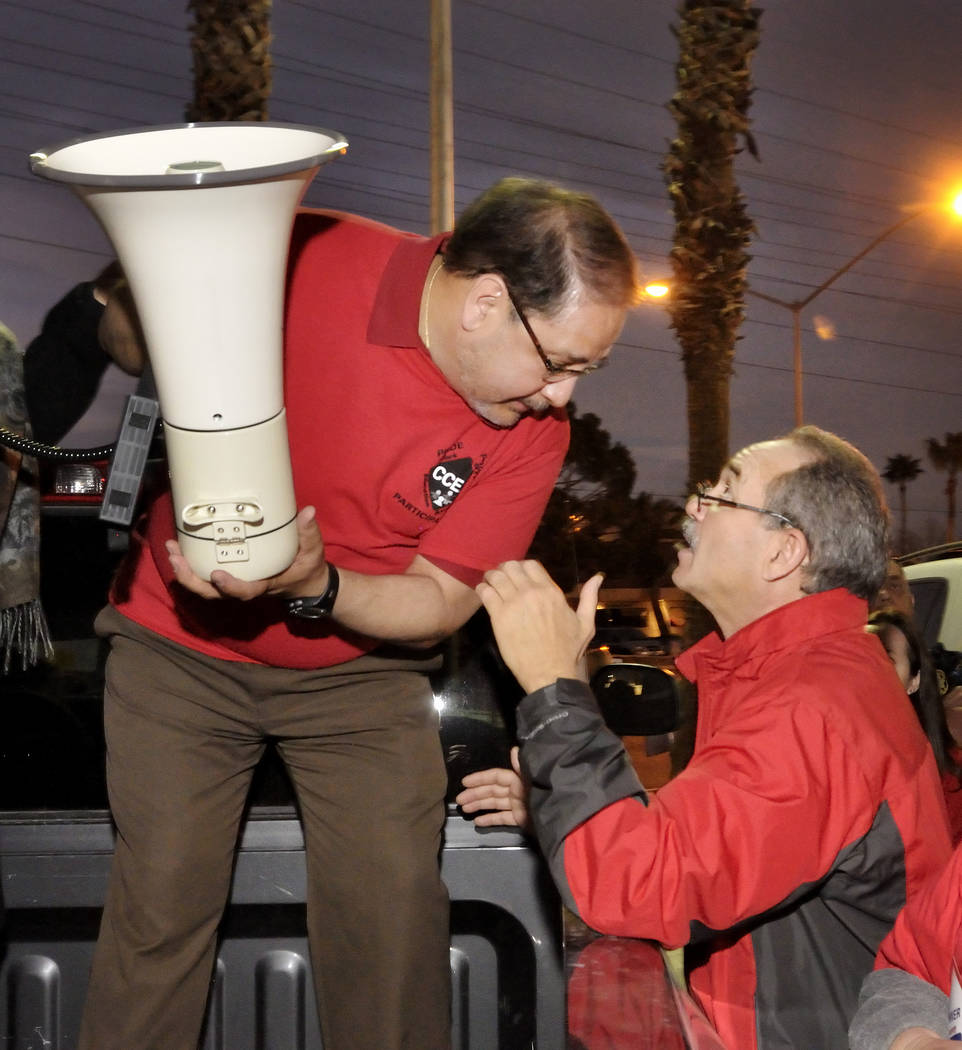 Clark County Education Association President Ruben Murillo, left, confers with CCEA Director John Vellardita during a rally outside the Edward Greer Education Center at 2832 E. Flamingo Road on Th ...