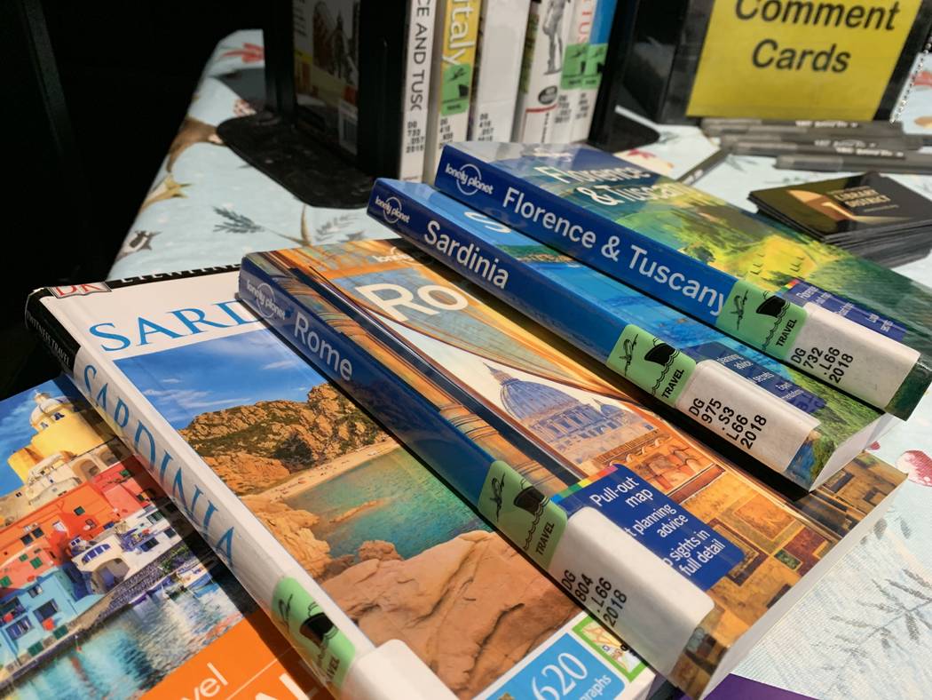 Lucia Taylor, who presented "Bella Italia," set up a table covered with books about Italy. She ...