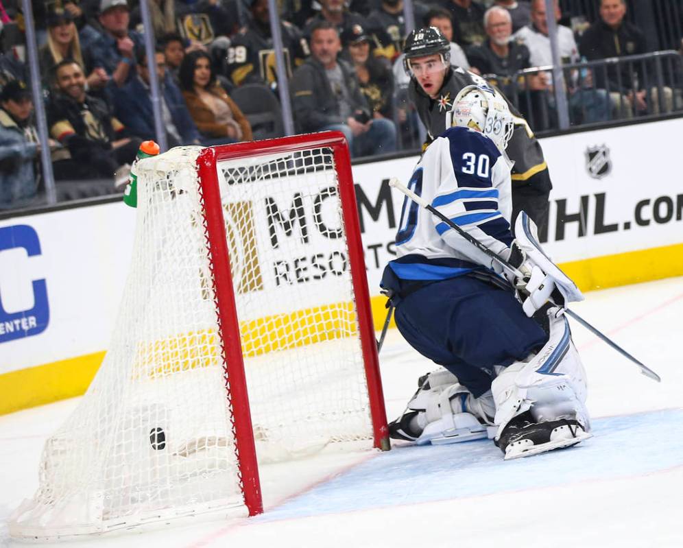 Golden Knights right wing Reilly Smith (19) scores past Winnipeg Jets goaltender Laurent Brossoit (30) during the first period of an NHL hockey game at T-Mobile Arena in Las Vegas on Thursday, Mar ...