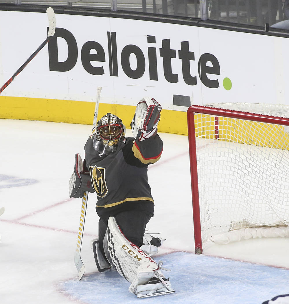 Golden Knights goaltender Malcolm Subban (30) watches the puck fly over during the third period of an NHL hockey game against the Winnipeg Jets at T-Mobile Arena in Las Vegas on Thursday, March 21 ...