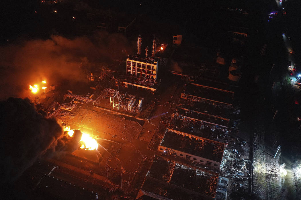 In this Thursday, March 21, 2019, aerial photo released by China's Xinhua News Agency, fires burn at the site of a factory explosion in a chemical industrial park in Xiangshui County of Yancheng i ...